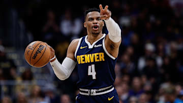 Apr 2, 2025; Denver, Colorado, USA; Denver Nuggets guard Russell Westbrook (4) gestures as he dribbles the ball up court in the third quarter against the San Antonio Spurs at Ball Arena. Mandatory Credit: Isaiah J. Downing-Imagn Images