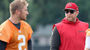 Jul 25, 2024; Tampa, FL, USA;  Tampa Bay Buccaneers offensive coordinator Liam Coen and quarterback Kyle Trask (2) during training camp at AdventHealth Training Center. Mandatory Credit: Kim Klement Neitzel-Imagn Images