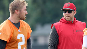 Jul 25, 2024; Tampa, FL, USA;  Tampa Bay Buccaneers offensive coordinator Liam Coen and quarterback Kyle Trask (2) during training camp at AdventHealth Training Center. Mandatory Credit: Kim Klement Neitzel-Imagn Images