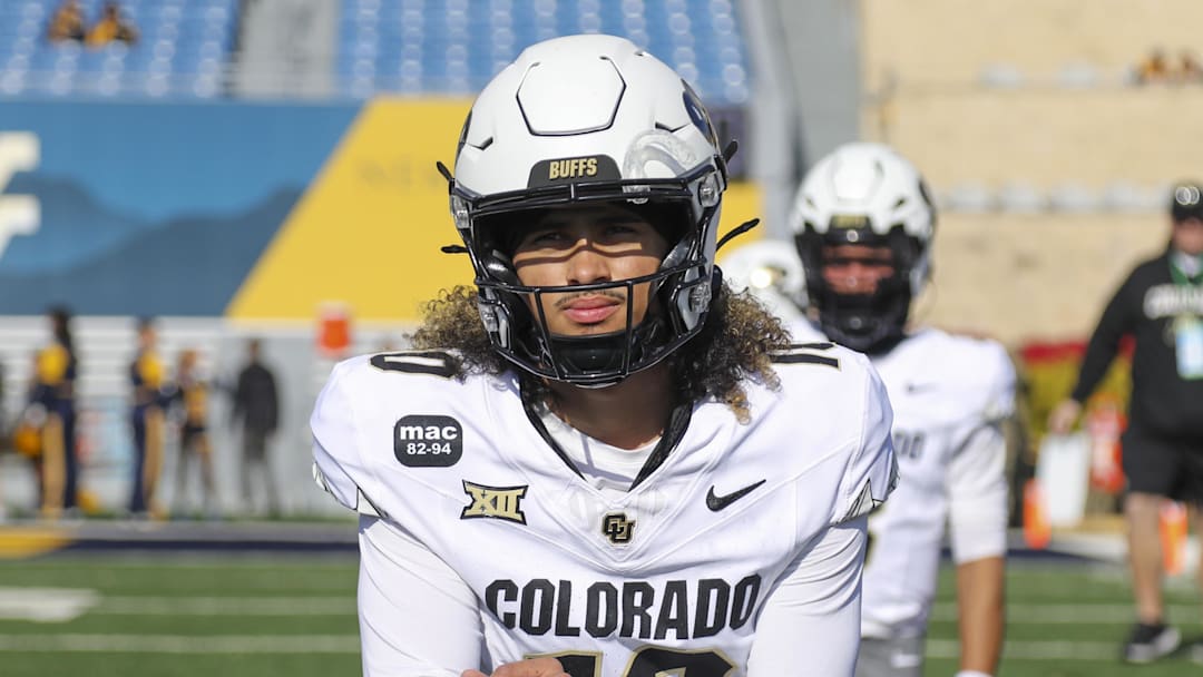 Nov 8, 2025; Morgantown, West Virginia, USA; Colorado Buffaloes quarterback Julian Lewis (10) warms up prior to their game against the West Virginia Mountaineers at Milan Puskar Stadium. Mandatory Credit: Ben Queen-Imagn Images