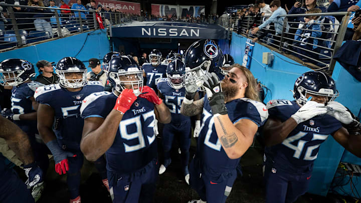 Tennessee Titans offensive and defensive lineman huddle in the tunnel before the game against the Dallas Cowboys at Nissan Stadium Thursday, Dec. 29, 2022, in Nashville, Tenn.