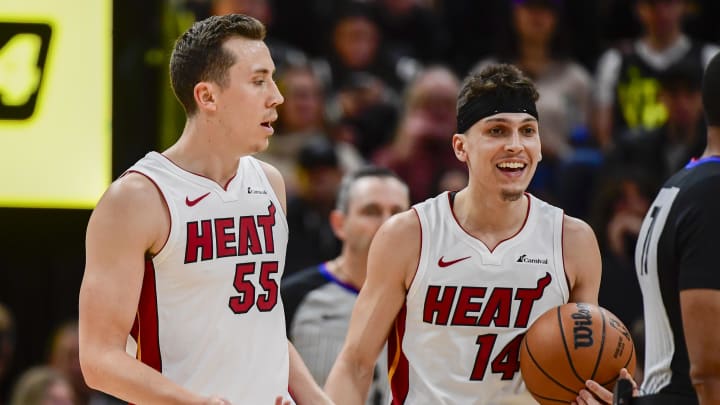 Dec 31, 2022; Salt Lake City, Utah, USA; Miami Heat forward Duncan Robinson (55) and guard Tyler Herro (14) react after a call against the Utah Jazz during the second half at Vivint Arena. Mandatory Credit: Christopher Creveling-USA TODAY Sports