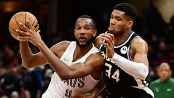 Dec 20, 2024; Cleveland, Ohio, USA; Cleveland Cavaliers forward Evan Mobley (4) drives to the basket against Milwaukee Bucks forward Giannis Antetokounmpo (34) during the second half at Rocket Mortgage FieldHouse. Mandatory Credit: Ken Blaze-Imagn Images