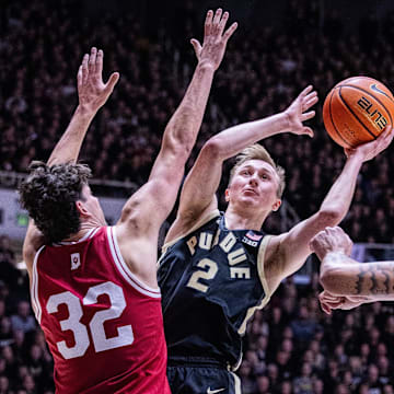 Purdue Boilermakers guard Fletcher Loyer shoots the ball while Indiana Hoosiers guard Trey Galloway defends 