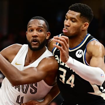 Dec 20, 2024; Cleveland, Ohio, USA; Cleveland Cavaliers forward Evan Mobley (4) drives to the basket against Milwaukee Bucks forward Giannis Antetokounmpo (34) during the second half at Rocket Mortgage FieldHouse. Mandatory Credit: Ken Blaze-Imagn Images