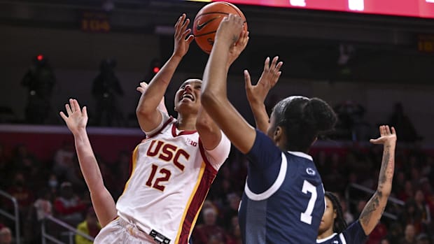 Jan 12, 2025; Los Angeles, California, USA; USC Trojans guard JuJu Watkins (12) scores between Penn State Nittany Lions guard