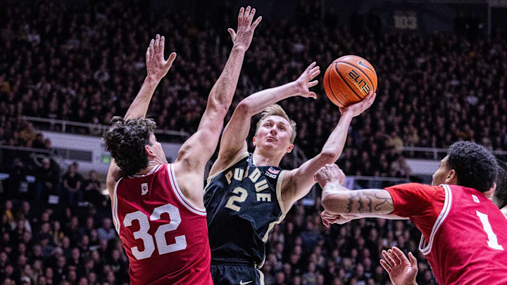 Purdue Boilermakers guard Fletcher Loyer shoots the ball while Indiana Hoosiers guard Trey Galloway defends 