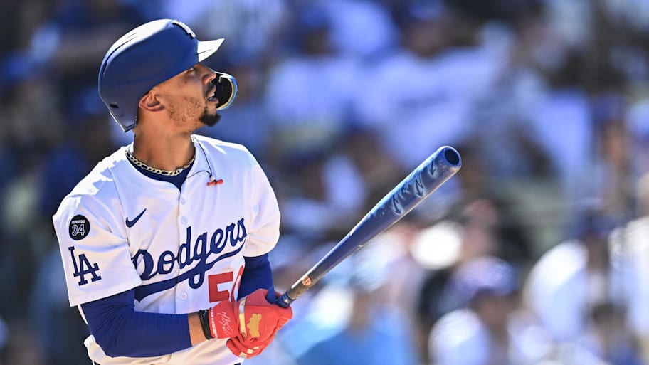 Mookie Betts hits a solo home run against the Padres to give the Dodgers the lead during the eighth inning at Dodger Stadium.  | Jonathan Hui-Imagn Images