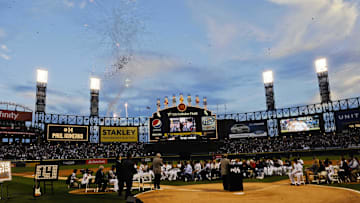 Fireworks are seen over US Cellular Field during a pregame ceremony honoring Chicago White Sox designated hitter Paul Konerko (14) before the game against the Kansas City Royals. 