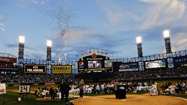 Fireworks are seen over US Cellular Field during a pregame ceremony honoring Chicago White Sox designated hitter Paul Konerko (14) before the game against the Kansas City Royals. 