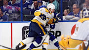 Oct 28, 2024; Tampa, Florida, USA; Nashville Predators defenseman Jeremy Lauzon (3) defends Tampa Bay Lightning center Luke Glendening (11) during the first period at Amalie Arena. Mandatory Credit: Kim Klement Neitzel-Imagn Images