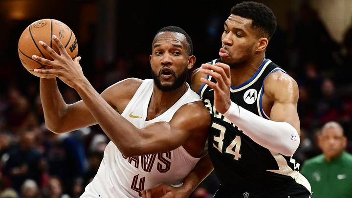 Dec 20, 2024; Cleveland, Ohio, USA; Cleveland Cavaliers forward Evan Mobley (4) drives to the basket against Milwaukee Bucks forward Giannis Antetokounmpo (34) during the second half at Rocket Mortgage FieldHouse. Mandatory Credit: Ken Blaze-Imagn Images
