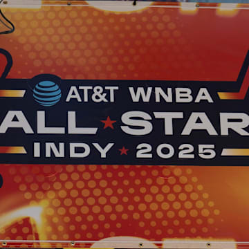 Signs advertising the WNBA All-Star games go up around Gainbridge Fieldhouse,