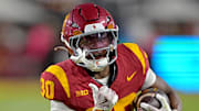Oct 11, 2025; Los Angeles, California, USA; USC Trojans running back King Miller (30) runs for a touchdown in the second half against the Michigan Wolverines at United Airlines Field at the Los Angeles Memorial Coliseum. Mandatory Credit: Jayne Kamin-Oncea-Imagn Images