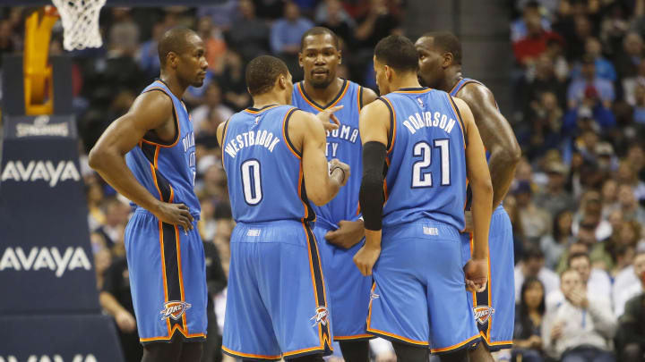 Feb 9, 2015; Denver, CO, USA; Oklahoma City Thunder guard Russell Westbrook (0), forward Kevin Durant (35), guard Andre Roberson (21), and forward Serge Ibaka (far right) huddle during the second half against the Denver Nuggets at Pepsi Center. The Thunder won 124-114. Mandatory Credit: Chris Humphreys-USA TODAY Sports