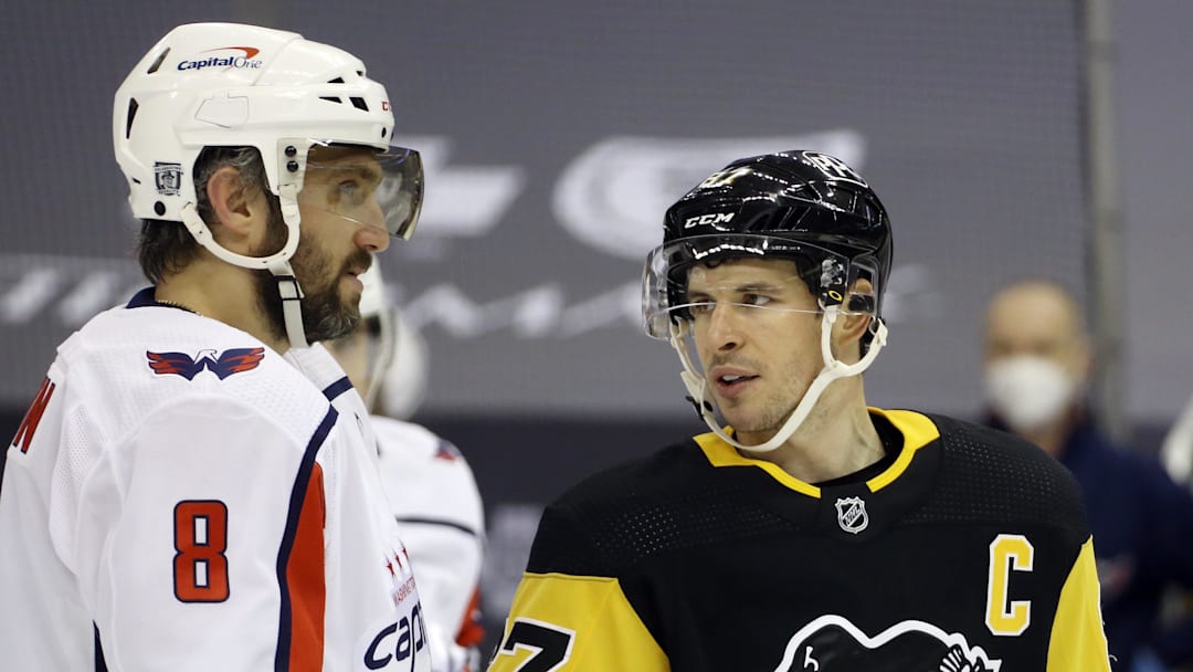 Two hockey legends; Mandatory Credit: Charles LeClaire-Imagn Images