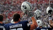 Sept. 19, 2009; Provo, UT, USA; BYU Cougars offensive lineman Jordan Richardson holds his helmet up with teammates during the kickoff for the game against the Florida State Seminoles at LaVell Edwards Stadium. Florida State defeated BYU 54-28.