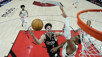 Jan 28, 2025; Portland, Oregon, USA; Portland Trail Blazers small forward Deni Avdija (8) shoots the ball against Milwaukee Bucks power forward Giannis Antetokounmpo (34) during the first half at Moda Center. Mandatory Credit: Soobum Im-Imagn Images