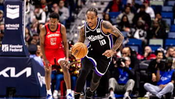Dec 12, 2024; New Orleans, Louisiana, USA; Sacramento Kings forward DeMar DeRozan (10) brings the ball up court against the New Orleans Pelicans center Yves Missi (21) during the second half at Smoothie King Center. Mandatory Credit: Stephen Lew-Imagn Images