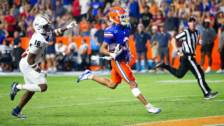 Florida Gators wide receiver Eugene Wilson III (3) runs for a touchdown as he looks back to Samford Bulldogs cornerback Kamron Smith (16) during the second half to make it 38-7 after the extra point at Ben Hill Griffin Stadium in Gainesville, FL on Saturday, September 7, 2024 against the Samford Bulldogs. The Florida Gators won 45-7 over the Bulldogs. [Doug Engle/Gainesville Sun]