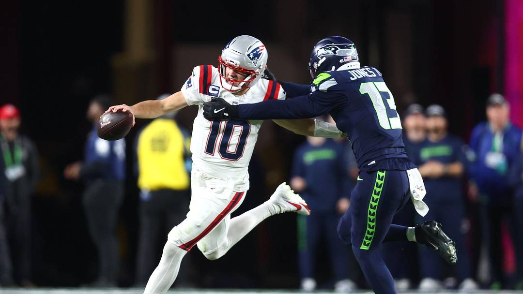 Feb 8, 2026; Santa Clara, CA, USA; New England Patriots quarterback Drake Maye (10) runs against Seattle Seahawks linebacker Ernest Jones IV (13) during the third quarter in Super Bowl LX at Levi's Stadium. Mandatory Credit: Mark J. Rebilas-Imagn Images