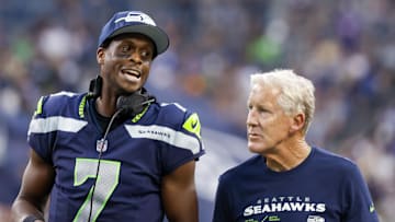 Aug 19, 2023; Seattle, Washington, USA; Seattle Seahawks quarterback Geno Smith (7) talks with head coach Pete Carroll during the second quarter against the Dallas Cowboys at Lumen Field. Mandatory Credit: Joe Nicholson-Imagn Images