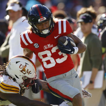 Nov 18, 2023; Oxford, Mississippi, USA; Mississippi Rebels wide receiver Cayden Lee (83) runs after a catch for a touchdown against Louisiana Monroe Warhawks linebacker Max Harris (24) during the second half at Vaught-Hemingway Stadium. Mandatory Credit: Petre Thomas-USA TODAY Sports
