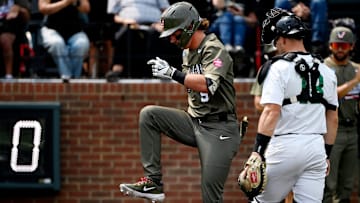 Vanderbilt's Brodie Johnston (9) steps on home plate after hitting a home run as Wright State catcher Boston Smith (18) watches during the second inning of the Nashville Regional NCAA Baseball Tournament elimination game at Hawkins Field Sunday, June 1, 2025, in Nashville, Tenn.