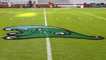Sep 4, 2021; Norman, Oklahoma, USA;  The logo of the Tulane Green Wave is displayed on the field before the game against the Oklahoma Sooners at Gaylord Family-Oklahoma Memorial Stadium. 