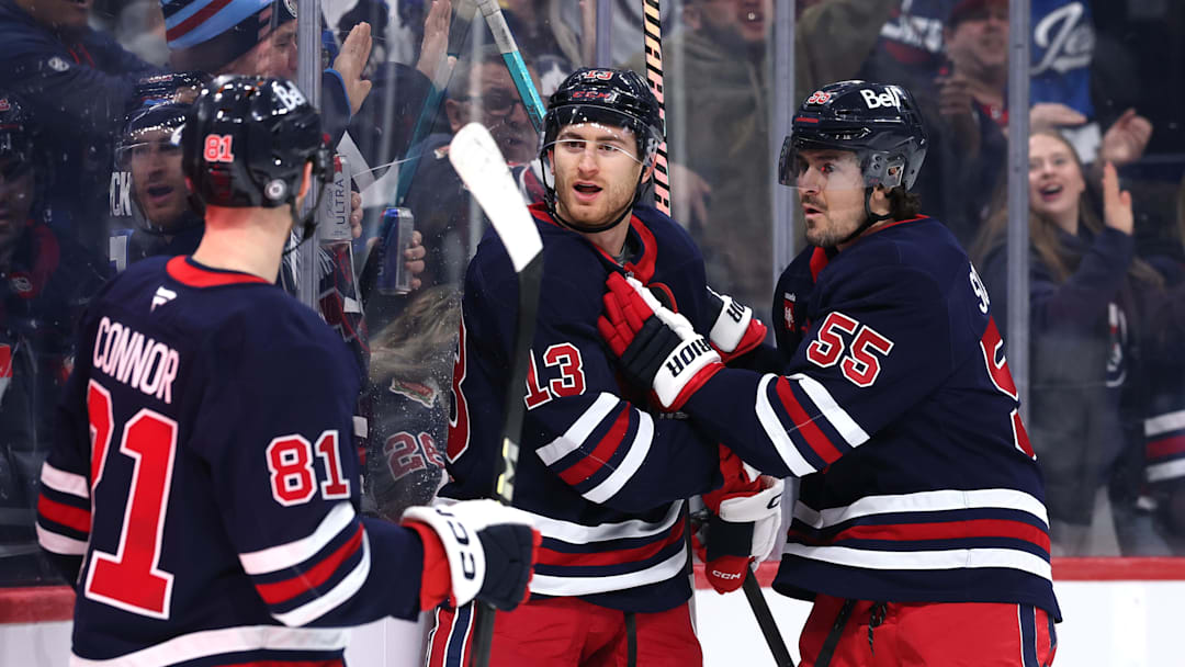Feb 7, 2025; Winnipeg, Manitoba, CAN; Winnipeg Jets center Gabriel Vilardi (13) celebrates his  goal with Winnipeg Jets left wing Kyle Connor (81) and Winnipeg Jets center Mark Scheifele (55) against the New York Islanders in the second period at Canada Life Centre. Mandatory Credit: James Carey Lauder-Imagn Images
