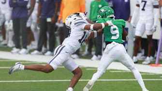 North Dakota Fighting Hawks running back Sawyer Seidl (9) runs the ball against Kansas State Wildcats safety Wesley Fair (18) during the first half against the Kansas State Wildcats at Bill Snyder Family Stadium on Aug. 30, 2025.