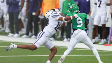 North Dakota Fighting Hawks running back Sawyer Seidl (9) runs the ball against Kansas State Wildcats safety Wesley Fair (18) during the first half against the Kansas State Wildcats at Bill Snyder Family Stadium on Aug. 30, 2025.