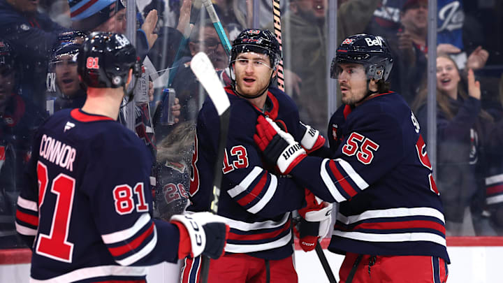 Feb 7, 2025; Winnipeg, Manitoba, CAN; Winnipeg Jets center Gabriel Vilardi (13) celebrates his  goal with Winnipeg Jets left wing Kyle Connor (81) and Winnipeg Jets center Mark Scheifele (55) against the New York Islanders in the second period at Canada Life Centre. Mandatory Credit: James Carey Lauder-Imagn Images