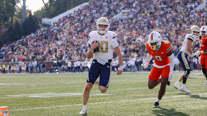 Nov 9, 2024; Atlanta, Georgia, USA; Georgia Tech Yellow Jackets quarterback Haynes King (10) runs for a touchdown against the Miami Hurricanes in the fourth quarter at Bobby Dodd Stadium at Hyundai Field. Mandatory Credit: Brett Davis-Imagn Images