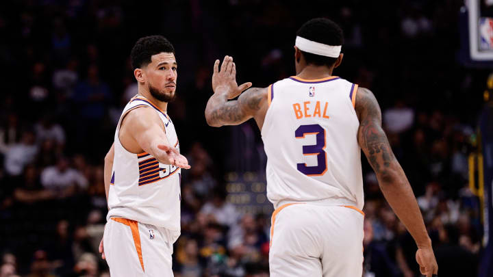 Mar 27, 2024; Denver, Colorado, USA; Phoenix Suns guard Devin Booker (1) and guard Bradley Beal (3) after the game against the Denver Nuggets at Ball Arena. Mandatory Credit: Isaiah J. Downing-USA TODAY Sports