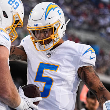 LA Chargers tight end Will Dissly (89) celebrates a touchdown against Detroit Lions with quarterback Trey Lance (5) during the first half of the Hall of Fame Game at Tom Benson Hall of Fame Stadium in Canton, Ohio on Thursday, July 31, 2025.