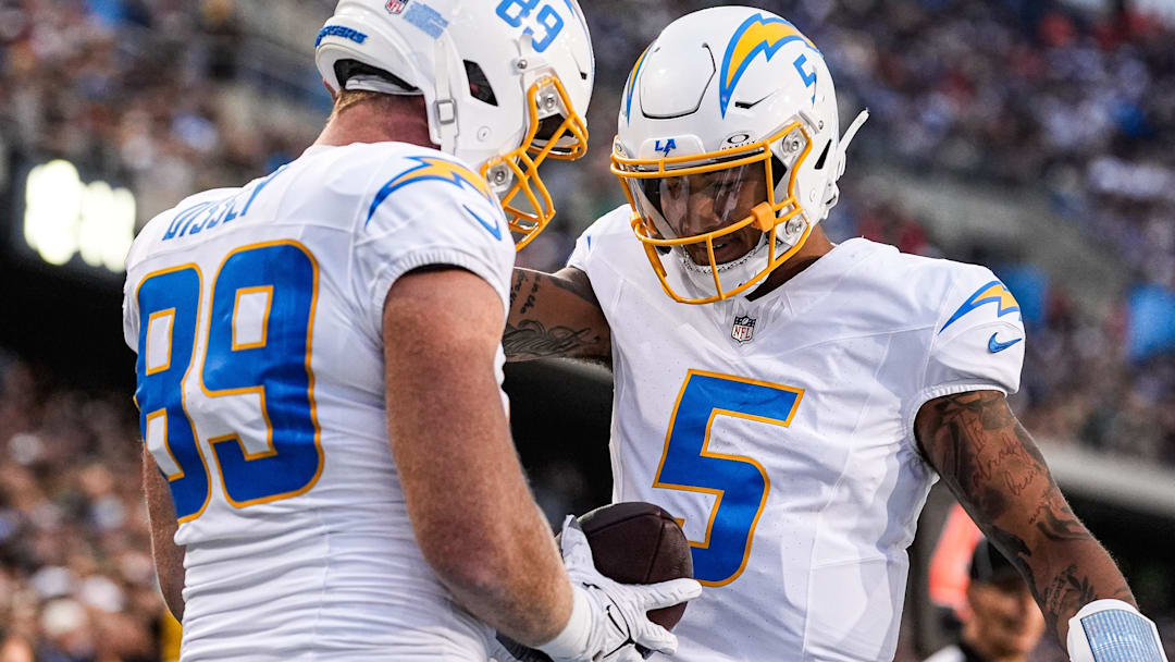 LA Chargers tight end Will Dissly (89) celebrates a touchdown against Detroit Lions with quarterback Trey Lance (5). LA Chargers tight end Will Dissly (89) celebrates a touchdown against Detroit Lions with quarterback Trey Lance (5).