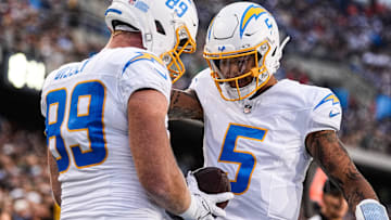 LA Chargers tight end Will Dissly (89) celebrates a touchdown against Detroit Lions with quarterback Trey Lance (5).