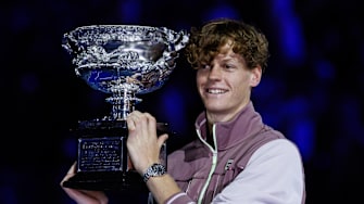 Jannik Sinner holds the trophy at the 2024 Australian Open.
