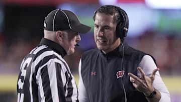 Oct 26, 2024; Madison, Wisconsin, USA; Wisconsin Badgers head coach Luke Fickell questions a call during the first quarter against the Penn State Nittany Lions at Camp Randall Stadium. Mandatory Credit: Mark Hoffman/USA TODAY Network via Imagn Images