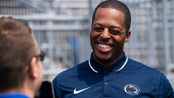 First-year Penn State wide receivers coach Marques Hagans laughs as he talks with a reporter during football media day at Beaver Stadium on Sunday, August 6, 2023, in State College.