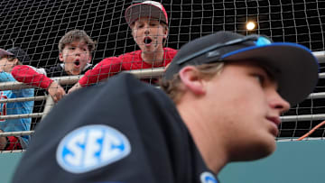 Some young Georgia fans bark at Kentucky players as they enter the dugout during a NCAA baseball game against Kentucky on March 14, 2025.