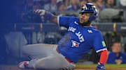 Toronto Blue Jays first baseman Vladimir Guerrero Jr. slid into home plate to score the go-ahead run in Game 3 of the 2025 World Series.