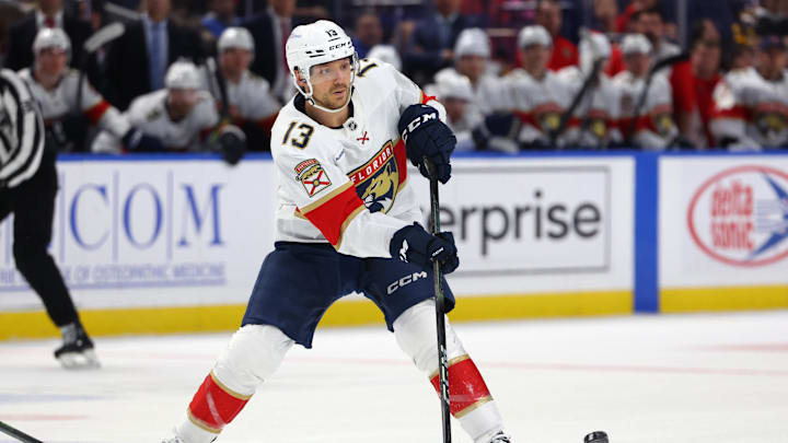 Oct 28, 2024; Buffalo, New York, USA;  Florida Panthers center Sam Reinhart (13) makes a pass during the third period against the Buffalo Sabres at KeyBank Center. Mandatory Credit: Timothy T. Ludwig-Imagn Images