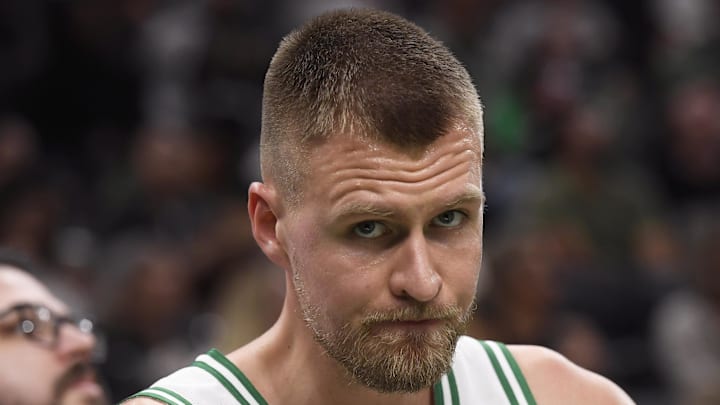Oct 17, 2023; Boston, Massachusetts, USA; Boston Celtics center Kristaps Porzingis (8) sits on the bench during the second half against the New York Knicks at TD Garden. Mandatory Credit: Bob DeChiara-Imagn Images