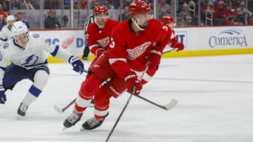Jan 21, 2024; Detroit, Michigan, USA; Detroit Red Wings defenseman Justin Holl (3) handles the puck during the first period at Little Caesars Arena. Mandatory Credit: Brian Bradshaw Sevald-Imagn Images