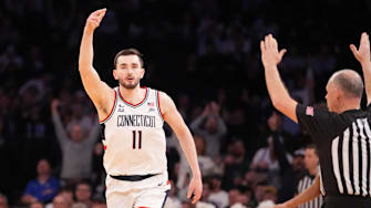 Mar 13, 2025; New York, NY, USA;  Connecticut Huskies forward Alex Karaban (11) celebrates a 3 pointer during the second half at Madison Square Garden. Mandatory Credit: Robert Deutsch-Imagn Images