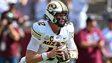 Oct 5, 2024; College Station, Texas, USA; Missouri Tigers quarterback Brady Cook (12) throws a pass in the first half against the Texas A&M Aggies at Kyle Field. Mandatory Credit: Maria Lysaker-Imagn Images. 