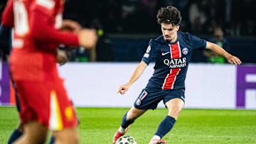 PSG midfielder Vitinha takes a shot during the game against Liverpool. 