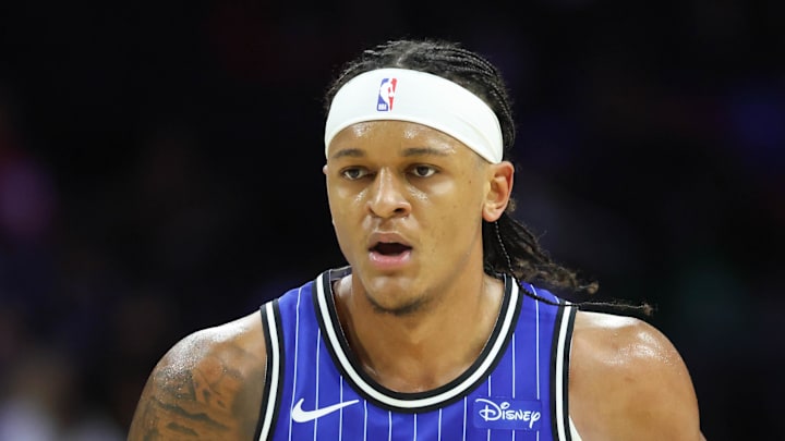 Orlando Magic forward Paolo Banchero dribbles the ball against the Philadelphia 76ers. Orlando Magic forward Paolo Banchero dribbles the ball against the Philadelphia 76ers.
